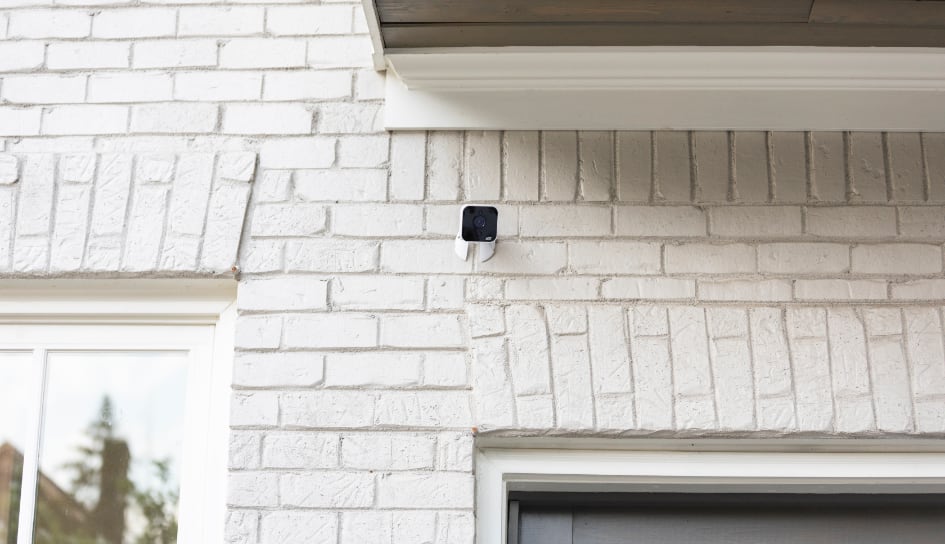 ADT outdoor camera on a Lansing home